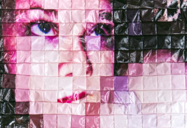Sewn Portrait Of Topless Woman Made Of Shiny Pixels Hung On The Wall